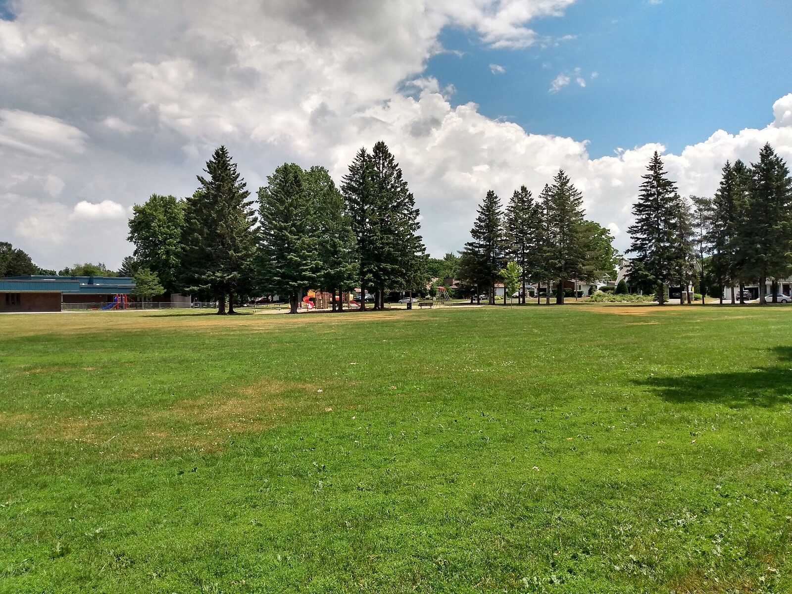 The open green and playground at Briargreen Park in Nepean.